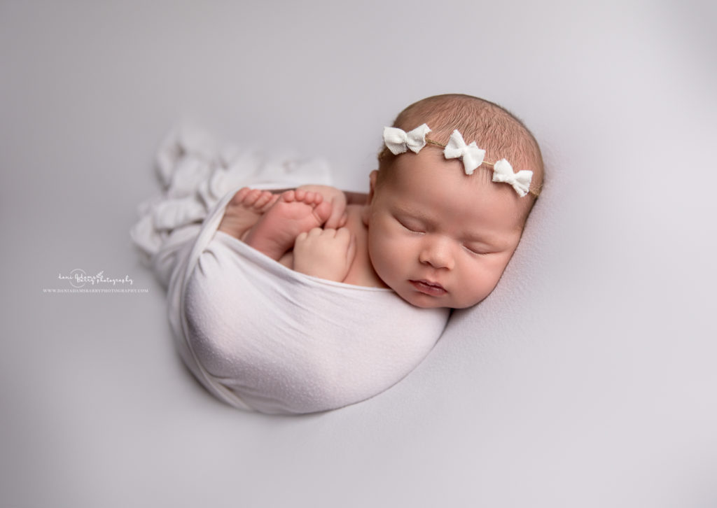 newborn baby girl white bow
